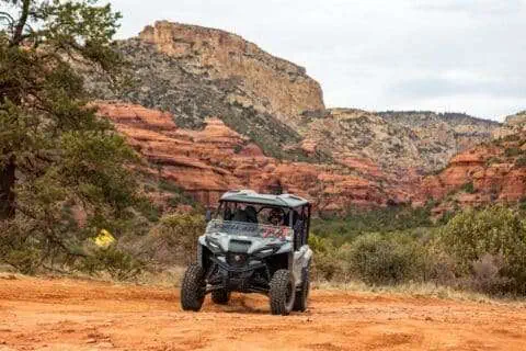 4-seater atv rental in front of beautiful red rock landscape of Sedona
