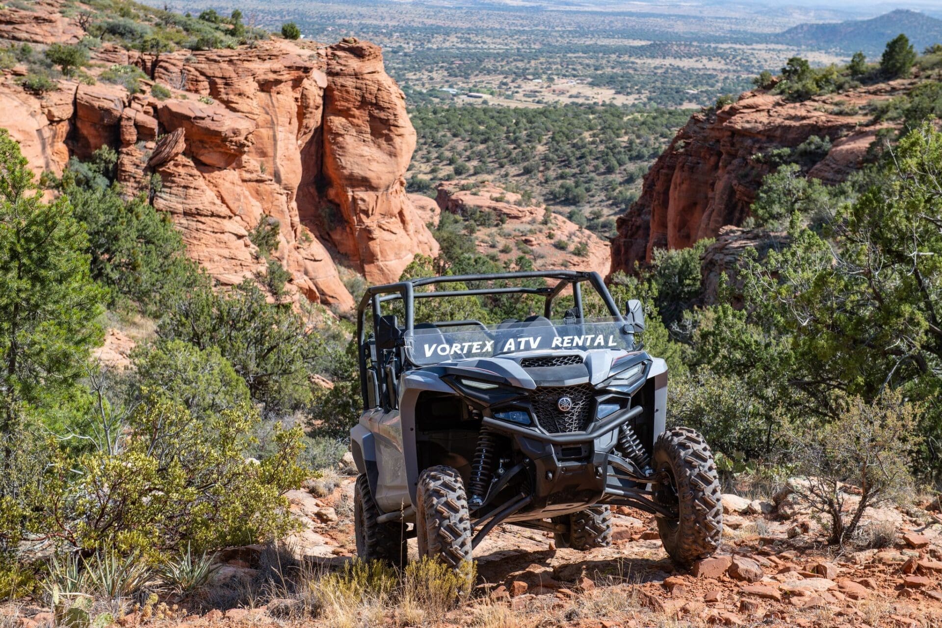 Sedona ATV Rental vehicle stagged on steep red rock landscape for photo