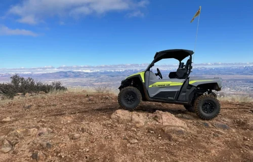 Vortex ATV rental posing on rock in Mingus Mountain